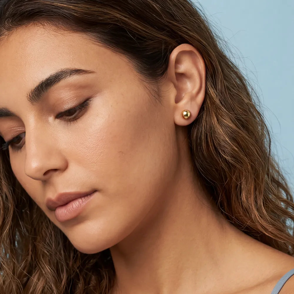 Belenia Stud Earrings on model
